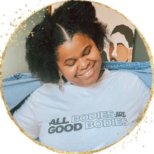 Image of Breah in a light blue t-shirt that reads "All Bodies are Good Bodies"